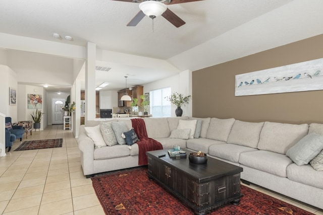 14903 Sugar Sweet Dr, Sugar Land, TX 77498 - living room with a ceiling fan, light tile patterned floors, and lofted ceiling