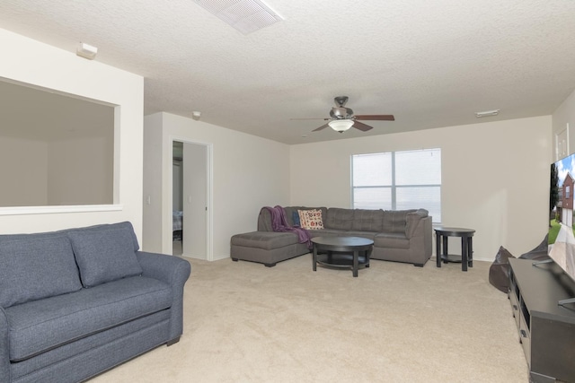 14903 Sugar Sweet Dr, Sugar Land, TX 77498 - living area with a ceiling fan, light carpet, and a textured ceiling
