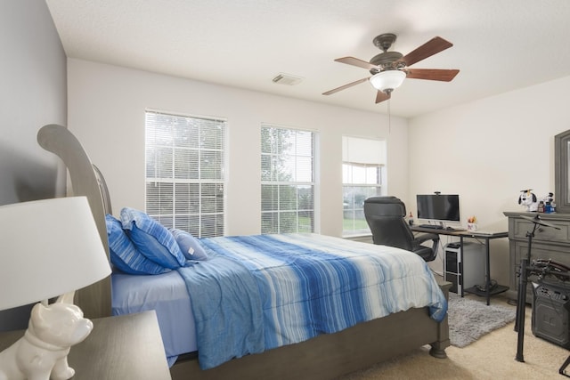 14903 Sugar Sweet Dr, Sugar Land, TX 77498 - bedroom featuring light colored carpet, a ceiling fan, and an office area