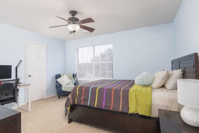 14903 Sugar Sweet Dr, Sugar Land, TX 77498 - bedroom featuring light colored carpet, ceiling fan, and an office area