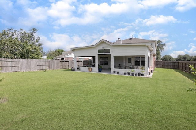 14903 Sugar Sweet Dr, Sugar Land, TX 77498 - rear view of house featuring a fenced backyard and a patio area