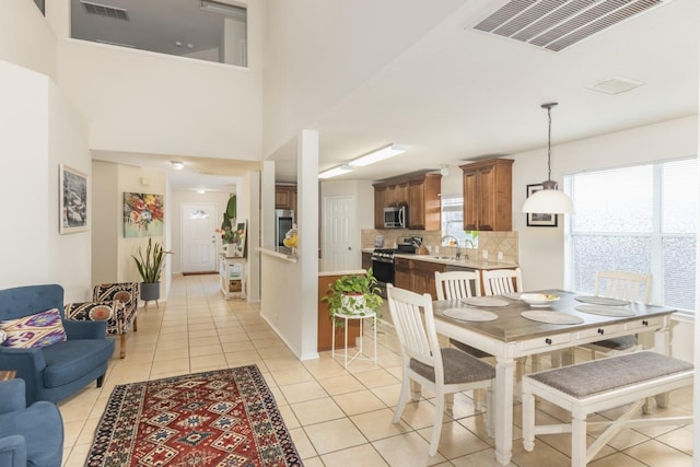 14903 Sugar Sweet Dr, Sugar Land, TX 77498 - dining space featuring light tile patterned floors