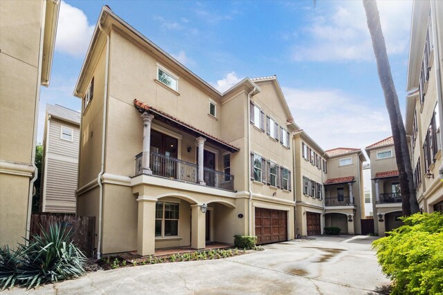 431 Jackson Hill St, Houston, TX 77007 - view of building exterior with concrete driveway and a garage