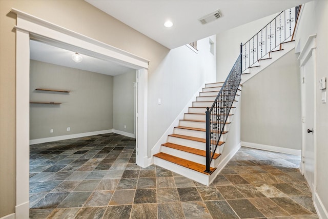 431 Jackson Hill St, Houston, TX 77007 - staircase with stone tile floors and recessed lighting