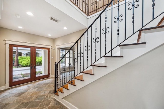 431 Jackson Hill St, Houston, TX 77007 - entrance foyer with stone tile flooring, french doors, recessed lighting, and stairs