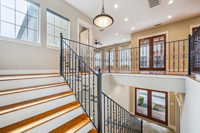431 Jackson Hill St, Houston, TX 77007 - staircase featuring french doors, recessed lighting, plenty of natural light, and a ceiling fan