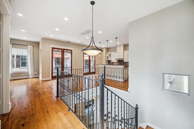 431 Jackson Hill St, Houston, TX 77007 - hallway featuring an upstairs landing, recessed lighting, light wood finished floors, and plenty of natural light