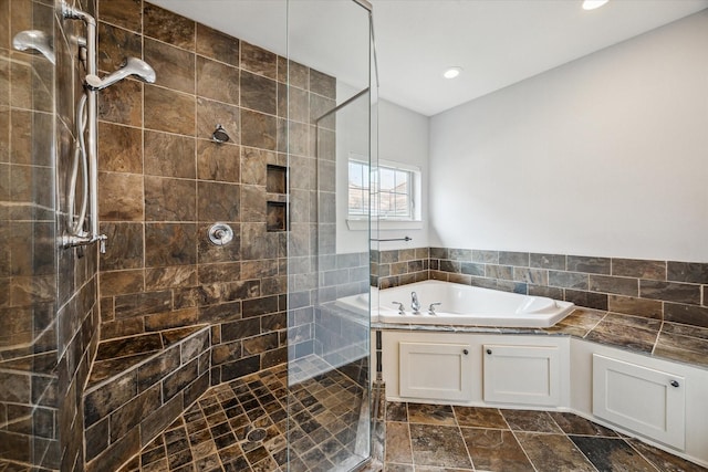 431 Jackson Hill St, Houston, TX 77007 - bathroom featuring a bath, a tile shower, and recessed lighting