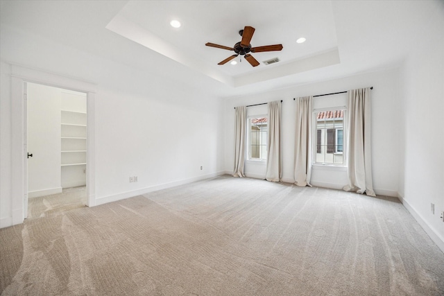 431 Jackson Hill St, Houston, TX 77007 - carpeted empty room featuring ceiling fan, a raised ceiling, and recessed lighting