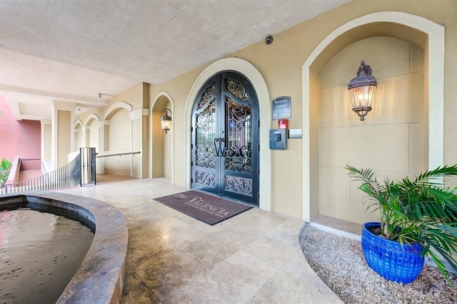 1711 Old Spanish Trl Unit 110, Houston, TX 77054 - view of exterior entry featuring stucco siding and french doors