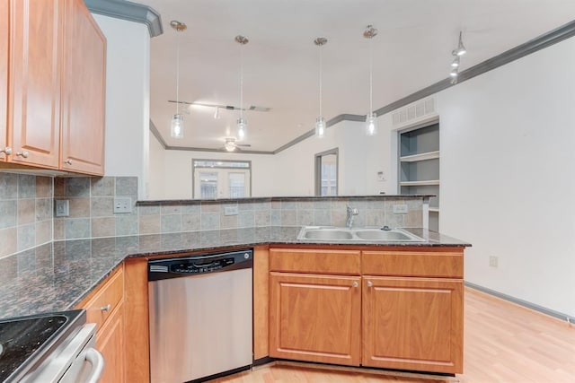 1711 Old Spanish Trl Unit 110, Houston, TX 77054 - kitchen with stainless steel appliances, dark stone countertops, light wood-style floors, ornamental molding, and backsplash