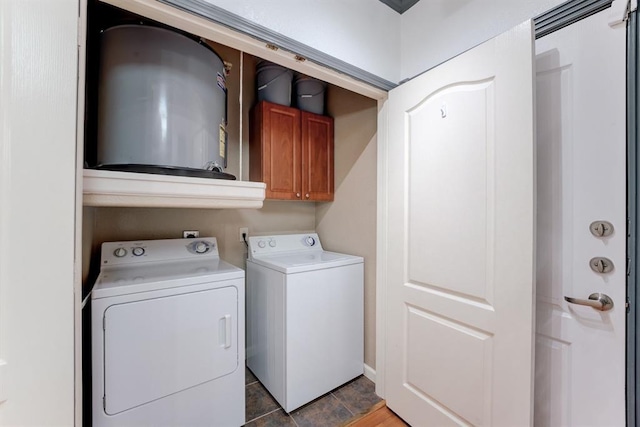 1711 Old Spanish Trl Unit 110, Houston, TX 77054 - laundry room featuring cabinet space, independent washer and dryer, and water heater