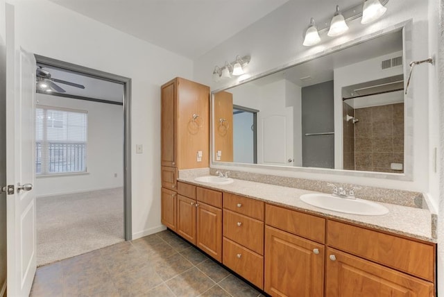 1711 Old Spanish Trl Unit 110, Houston, TX 77054 - full bath with double vanity, tiled shower, tile patterned flooring, and ceiling fan