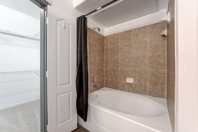 1711 Old Spanish Trl Unit 110, Houston, TX 77054 - bathroom with shower / tub combo with curtain and a spacious closet