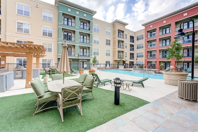 1711 Old Spanish Trl Unit 110, Houston, TX 77054 - view of pool with a pool with connected hot tub, a pergola, and a patio area