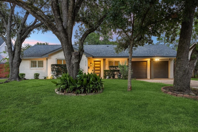2022 Chaparral Dr, Houston, TX 77043 - view of front facade with a shingled roof, an attached garage, stucco siding, and a yard