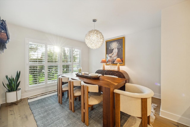 2022 Chaparral Dr, Houston, TX 77043 - dining room with a chandelier and light wood-style flooring