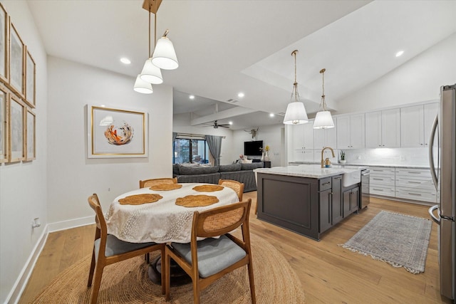 2022 Chaparral Dr, Houston, TX 77043 - dining room featuring light wood-style flooring, recessed lighting, a ceiling fan, and vaulted ceiling