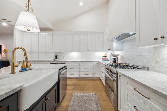 2022 Chaparral Dr, Houston, TX 77043 - kitchen featuring stainless steel appliances, white cabinets, tasteful backsplash, decorative light fixtures, and high vaulted ceiling
