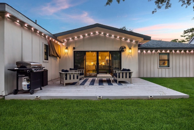 2022 Chaparral Dr, Houston, TX 77043 - back of house at dusk featuring board and batten siding, a deck, an outdoor living space, and a yard