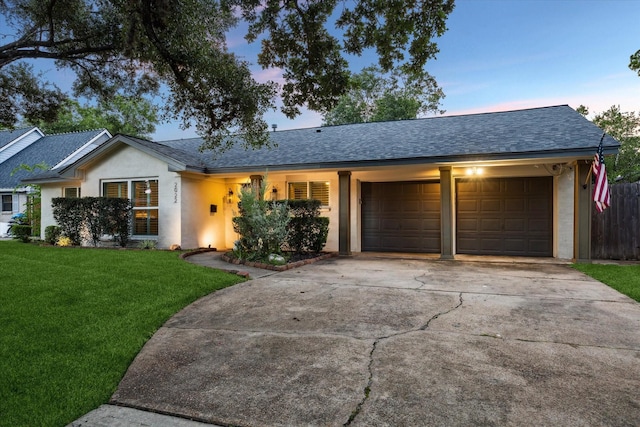 2022 Chaparral Dr, Houston, TX 77043 - ranch-style home featuring an attached garage, driveway, a shingled roof, and stucco siding