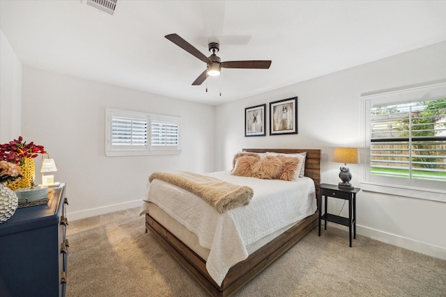 2022 Chaparral Dr, Houston, TX 77043 - bedroom featuring light colored carpet, multiple windows, and a ceiling fan