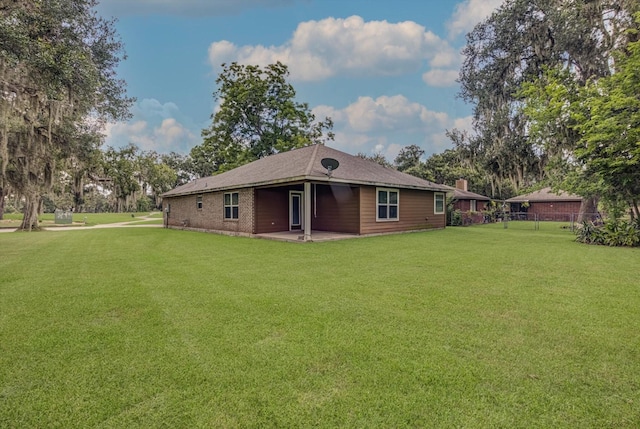 2440 Olympia Dr, West Columbia, TX 77486 - rear view of property featuring a patio and brick siding