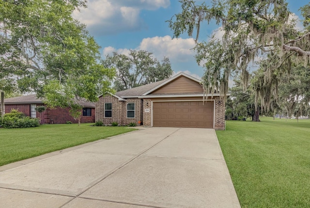 2440 Olympia Dr, West Columbia, TX 77486 - ranch-style house with an attached garage, a front yard, concrete driveway, and brick siding