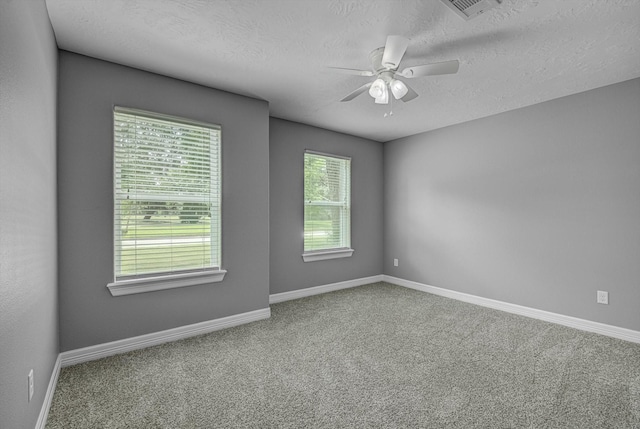 2440 Olympia Dr, West Columbia, TX 77486 - carpeted spare room featuring a ceiling fan and a textured ceiling