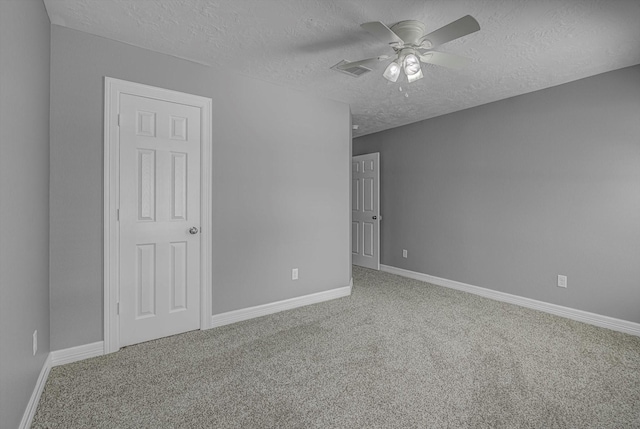 2440 Olympia Dr, West Columbia, TX 77486 - carpeted spare room featuring a textured ceiling and a ceiling fan