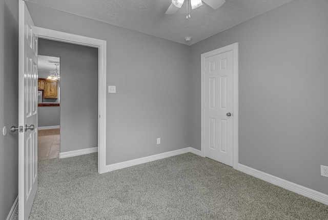 2440 Olympia Dr, West Columbia, TX 77486 - carpeted spare room with a ceiling fan, a textured ceiling, and a smoke detector