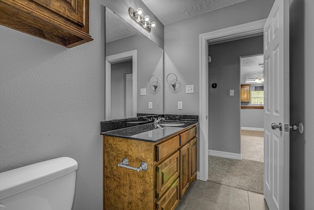 2440 Olympia Dr, West Columbia, TX 77486 - bathroom featuring tile patterned flooring and vanity