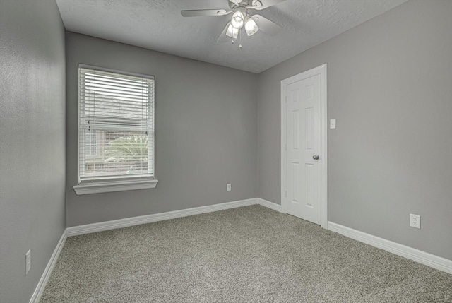 2440 Olympia Dr, West Columbia, TX 77486 - empty room featuring carpet flooring, ceiling fan, and a textured ceiling