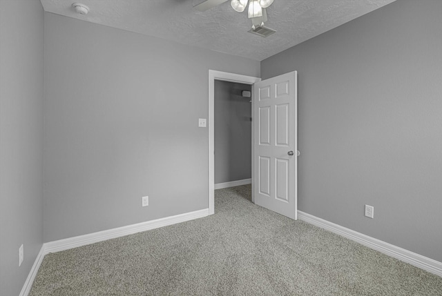 2440 Olympia Dr, West Columbia, TX 77486 - spare room with carpet flooring, ceiling fan, a textured ceiling, and a smoke detector