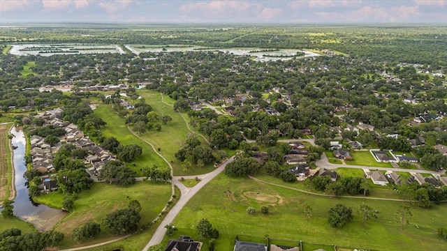 2440 Olympia Dr, West Columbia, TX 77486 - aerial view of property and surrounding area featuring a large body of water and nearby suburban area