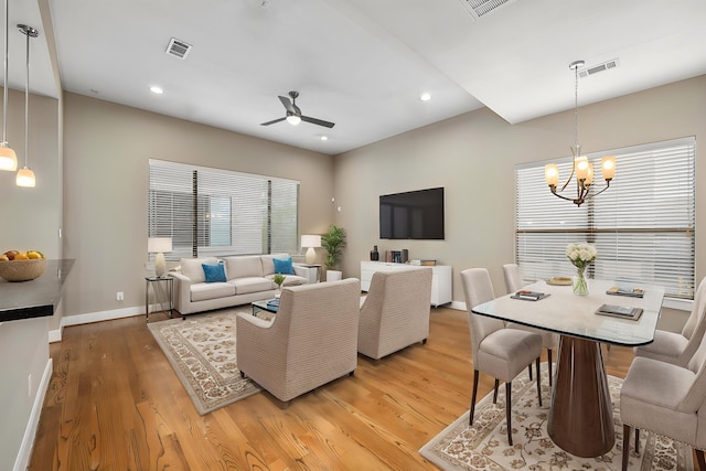 1801 Radcliffe St, Houston, TX 77007 - living room with ceiling fan, light wood-style floors, a chandelier, and recessed lighting