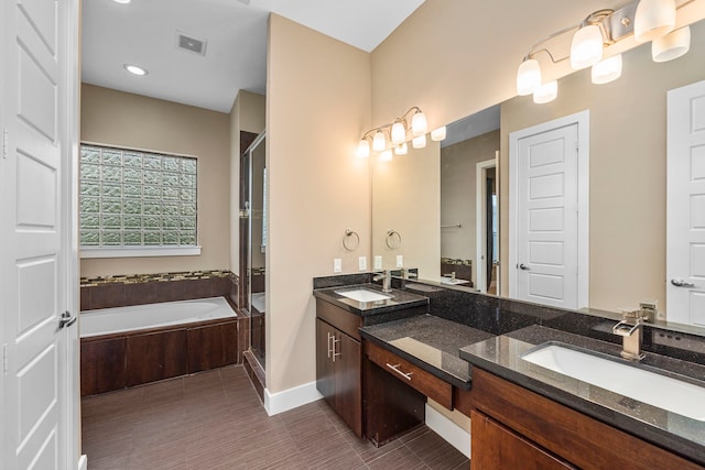 1801 Radcliffe St, Houston, TX 77007 - bathroom with double vanity, a stall shower, a garden tub, recessed lighting, and tile patterned flooring