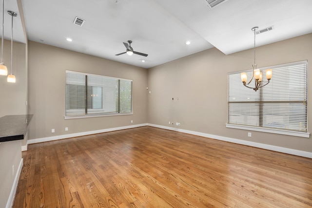 1801 Radcliffe St, Houston, TX 77007 - unfurnished living room featuring ceiling fan, a chandelier, wood finished floors, and recessed lighting