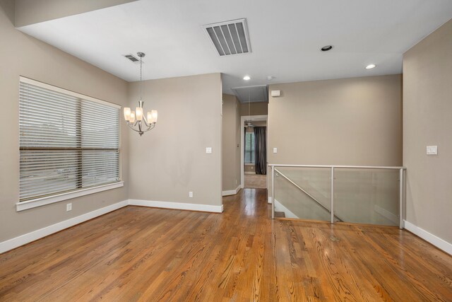 1801 Radcliffe St, Houston, TX 77007 - unfurnished room featuring attic access, wood finished floors, and recessed lighting