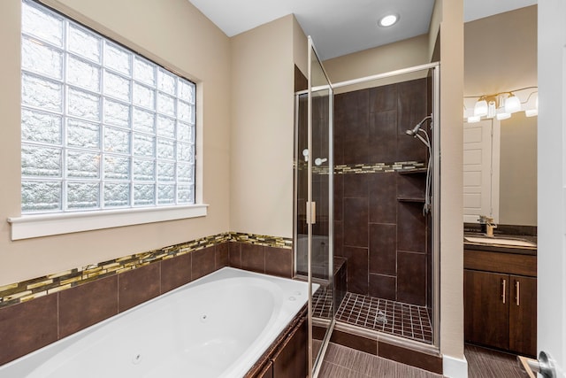 1801 Radcliffe St, Houston, TX 77007 - full bath with a shower stall, a whirlpool tub, vanity, and plenty of natural light