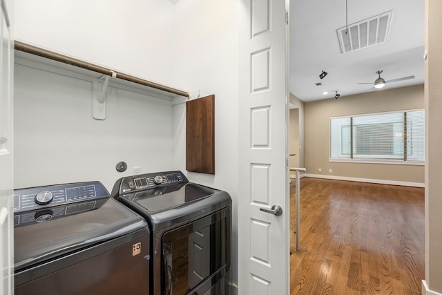 1801 Radcliffe St, Houston, TX 77007 - laundry room with independent washer and dryer, wood finished floors, and a ceiling fan