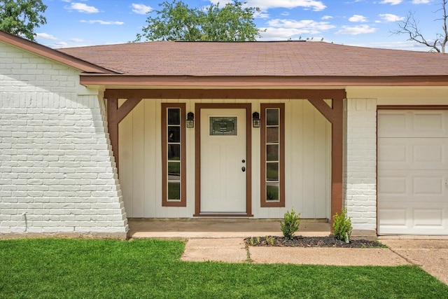 21507 Glenbranch Dr, Spring, TX 77388 - view of exterior entry with brick siding, a shingled roof, covered porch, and a garage