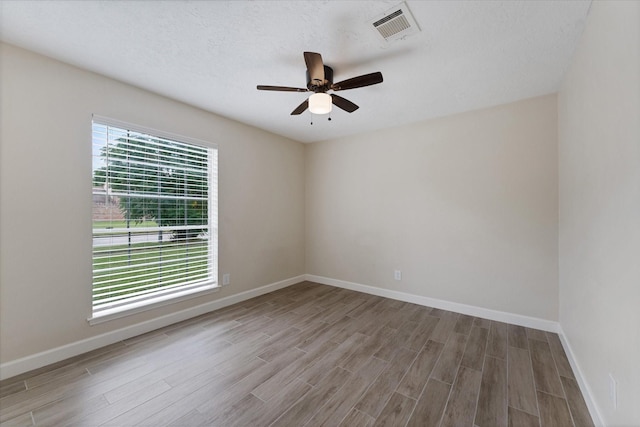21507 Glenbranch Dr, Spring, TX 77388 - empty room with wood finished floors and ceiling fan