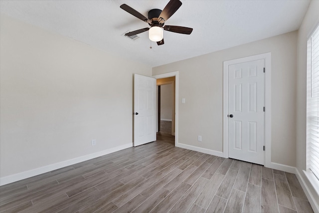 21507 Glenbranch Dr, Spring, TX 77388 - unfurnished bedroom with wood finished floors and ceiling fan