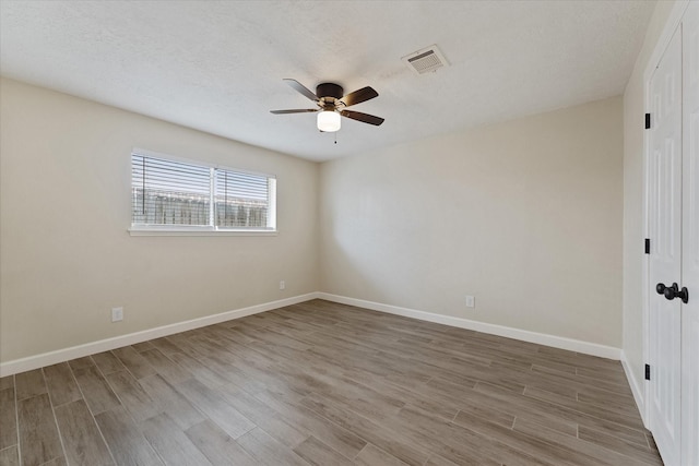 21507 Glenbranch Dr, Spring, TX 77388 - spare room featuring a ceiling fan, wood finished floors, and a textured ceiling