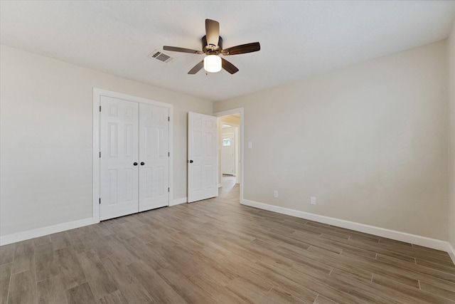 21507 Glenbranch Dr, Spring, TX 77388 - unfurnished bedroom featuring light wood-style floors, a ceiling fan, and a closet