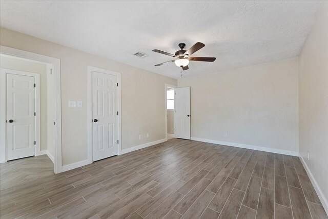21507 Glenbranch Dr, Spring, TX 77388 - unfurnished room with wood finished floors and a ceiling fan