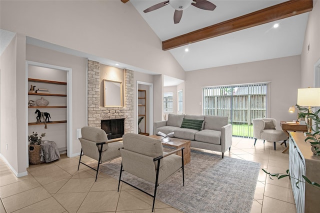 16606 Neumann Dr, Houston, TX 77058 - living area featuring a ceiling fan, beamed ceiling, a fireplace, high vaulted ceiling, and light tile patterned flooring