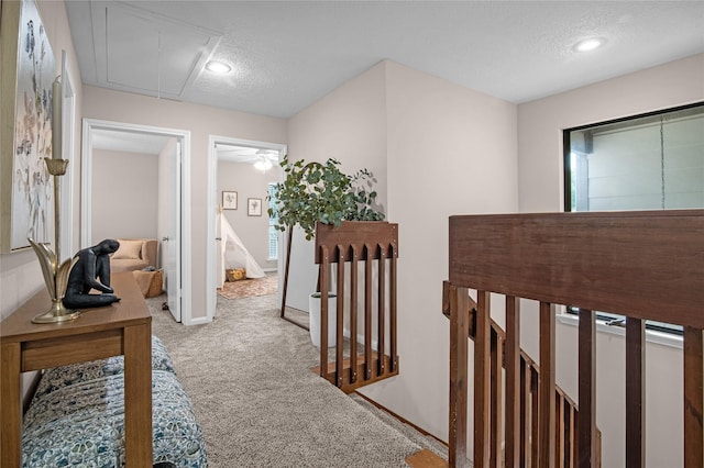 16606 Neumann Dr, Houston, TX 77058 - hall featuring attic access, carpet, a textured ceiling, and recessed lighting