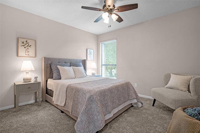 16606 Neumann Dr, Houston, TX 77058 - bedroom with light colored carpet, ceiling fan, and a textured ceiling
